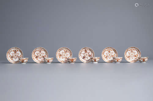 Six Chinese iron red and gilt cups and saucers with floral design, Kangxi/Yongzheng