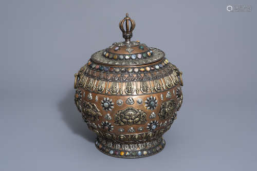 A Tibetan silver and semi-precious stones inlaid brass jar and cover, 20th C.