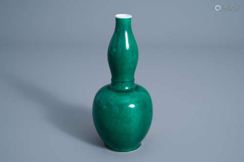 A Chinese monochrome apple-green double gourd vase, 19th C.