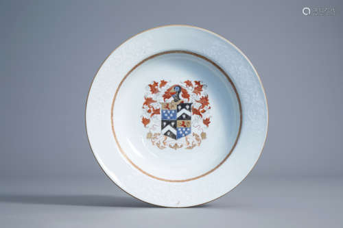 A Chinese export porcelain armorial plate with bianco sopra bianco design, Qianlong