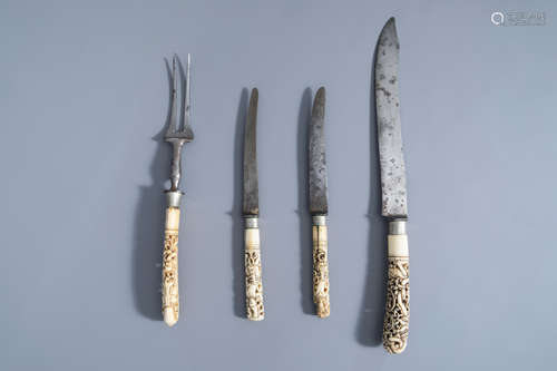 A meat knife and fork and two knives with carved ivory handles with dancing figures, India or Indone