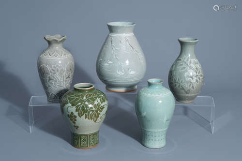 Five Korean celadon ground vases with floral design, 20th C.