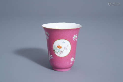 A Chinese famille rose 'ruby ground' wine cup with floral design, Hongxian mark, 20th C.