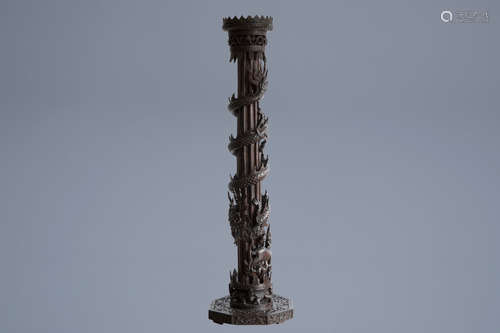 A Chinese or Vietnamese carved wooden column with a dragon and a phoenix, 19th C.