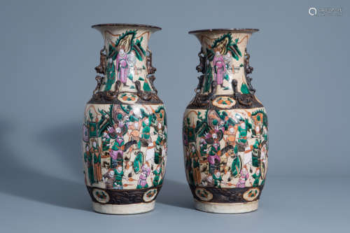 A pair of Chinese Nanking crackle glazed famille rose vases with warrior scenes, 19th C.