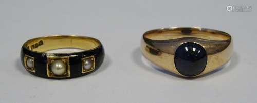 Gold coloured metal, enamel and seed pearl mourning ring and a gold coloured metal and onyx set