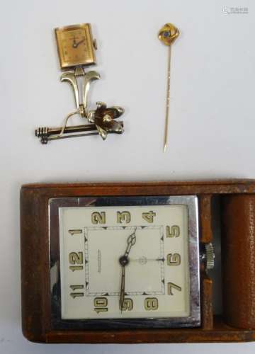 Crawford nurse's watch in yellow metal, a yellow metal pin in case and a Jaeger-le-Coultre clock
