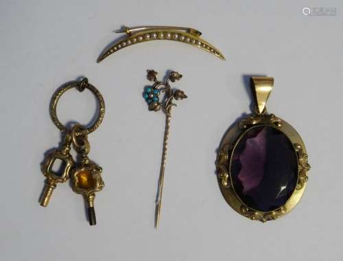 Gilt metal and pale amethyst coloured stone pendant, two ornate watch keys, a gold coloured metal