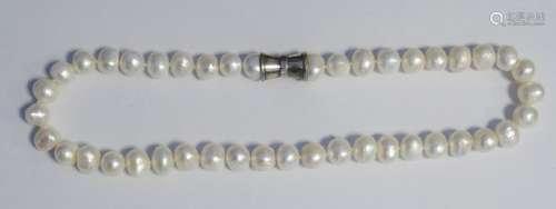 Modern string of baroque pearls with silver clasp