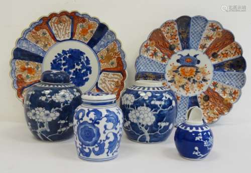 Two Japanese Imari circular dishes and four blue and white Oriental ginger jars (one missing lid and