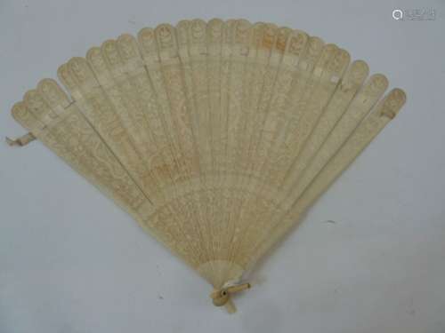 A 19th century bone fan, shallow relief, decorated with oval motif initials MV (?) , flanked by