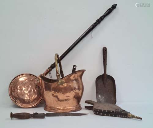 Copper warming pan, a copper coal scuttles, bellows and other fire tools