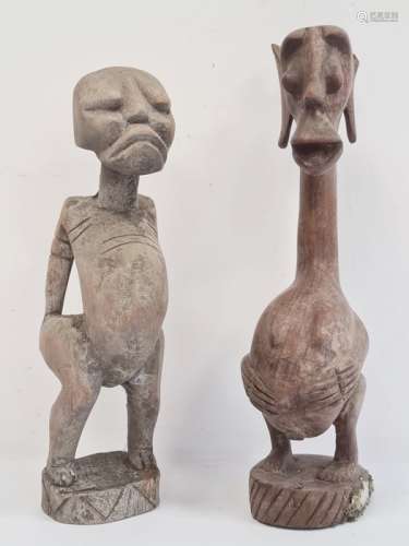 African carved fertility figure, 36cm high and another Grebo-style carved figure, 33cm high (2)