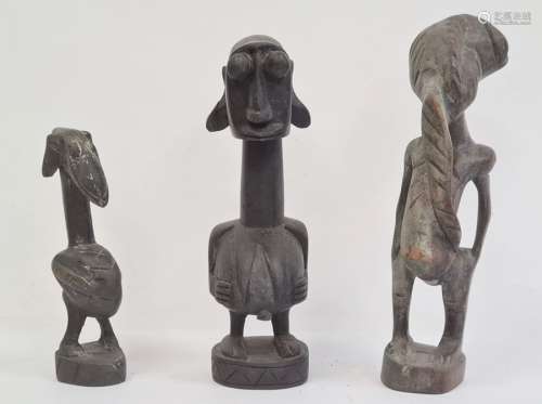 African carved fertility figure, 24cm high, another carved small fertility figure, 17.5cm and a