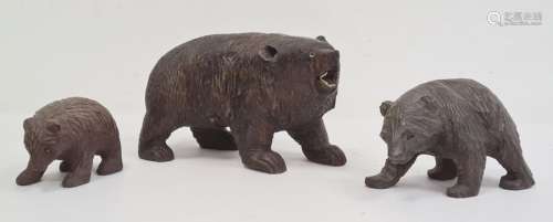 Carved Black Forest bear with glass eyes and white teeth (one eye missing and some teeth missing),