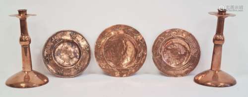 Pair of Arts & Crafts Birmingham School copper candlesticks and three assorted circular copper