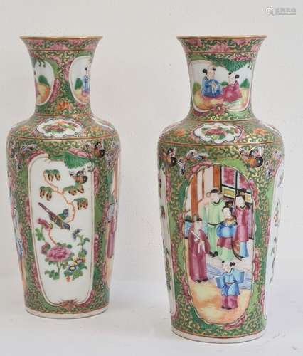 Pair of Chinese Canton baluster vases, each painted in a typical palette with figures on terracing