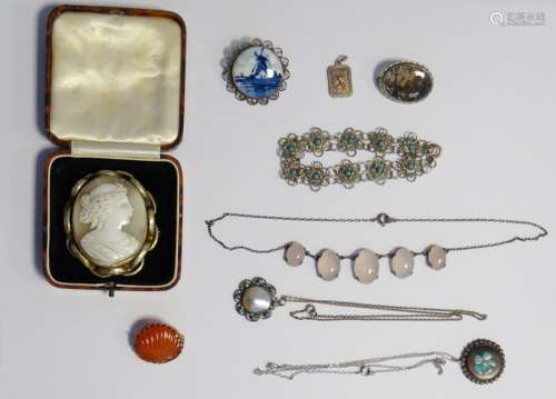 Cameo brooch set in gold-coloured mount, a silver-coloured pendant with turquoise and shell inlay, a