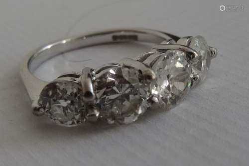 18ct white gold diamond four-stone ring, set with round brilliant-cut and old-cut diamonds (