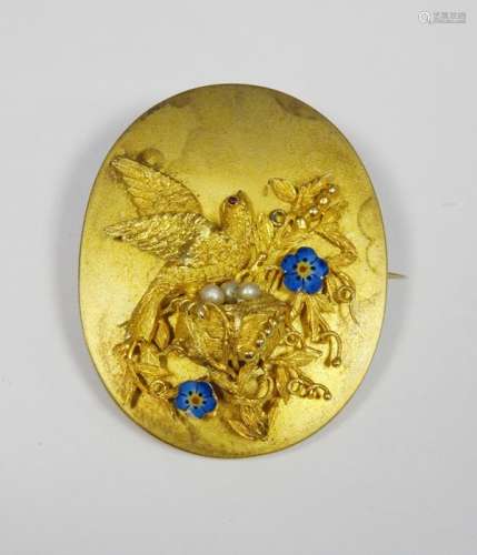 Victorian gold-coloured oval brooch/pendant with relief of bird and nest, with enamelled flowers and
