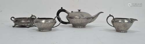 Hammered pewter three piece tea set and a two handled dish (4)