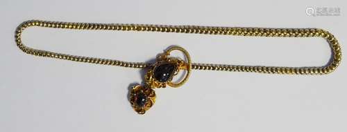 Victorian gold-coloured metal and cabochon garnet necklace, the snake-pattern chain with ornate