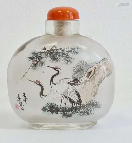 Two Chinese painted glass snuff bottles and two glass covers, the largest painted with buildings and