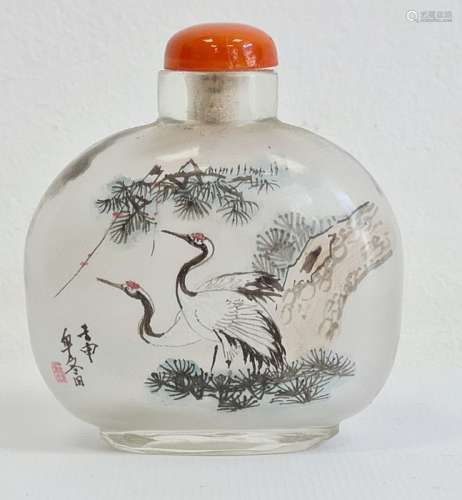 Two Chinese painted glass snuff bottles and two glass covers, the largest painted with buildings and