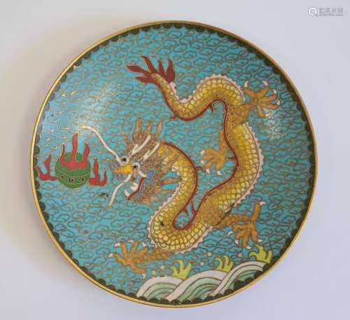 Chinese cloisonne saucer, decorated with a dragon chasing a flaming pearl, reserved on a blue