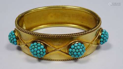 Victorian gold coloured metal hinged bangle having raised turquoise set circular balls within