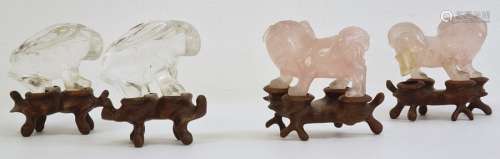 Pair of Chinese rose quartz models of lion dogs, 5cm long and a pair of quartz models of hares,