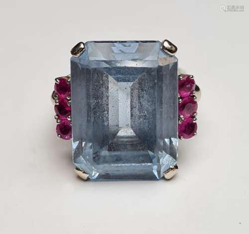 Pale blue paste and ruby ring set centre rectangular step-cut paste stone (20mm x 14mm) flanked by