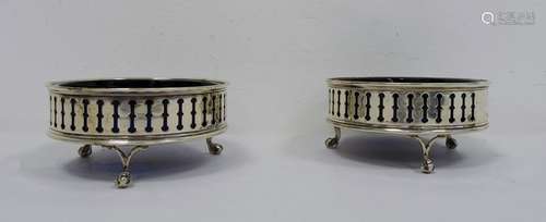 Pair of early 20th century silver and blue glass circular salts with pierced decoration,