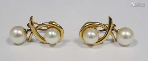 Pair of 14ct gold and pearl earrings, each with single pearl and crossover design and having pearl