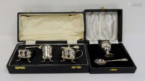 1930's silver cased three-piece cruet set with two spoons, Sheffield 1939, makers E&H, 4.7oz and a