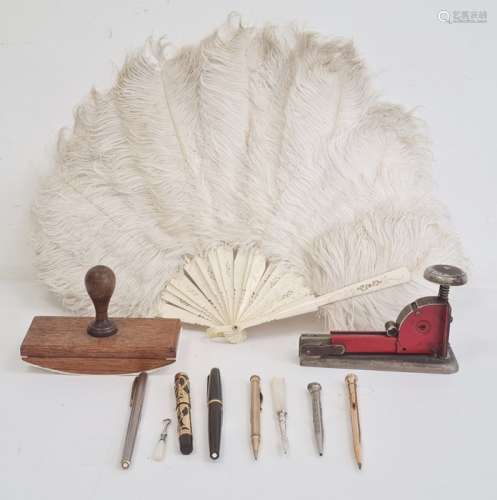 Bone and white ostrich feather fan, a blotter, a stapler, a Waterman Ideal fountain pen, fountain
