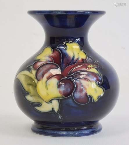 Moorcroft pottery miniature squat vase in hibiscus pattern, on blue ground, 9cm high