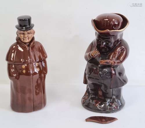 Treacle glazed Toby jug and a pottery figure decanter (2)
