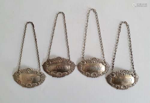Set of four silver port, sherry, brandy and whisky labels, Birmingham, maker's mark B&Co, 1.3oz or