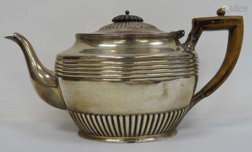 Early 20th century silver teapot with wooden handle, gadrooned and reeded decoration, Sheffield