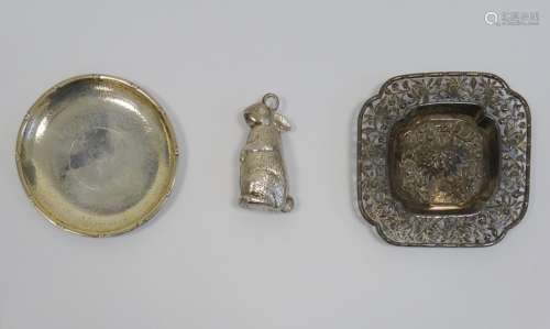 White metal and foreign silver wares to include pin dish, embossed and pierced tray and rattle in