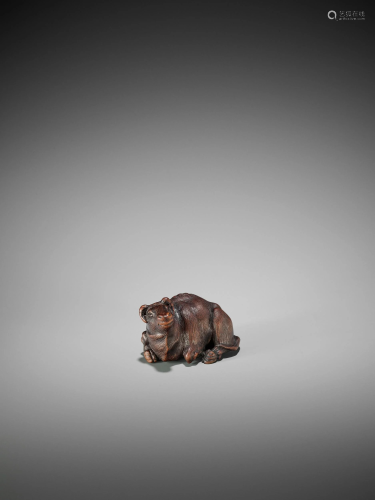 MASAJO: A FINE WOOD NETSUKE OF A RECU…