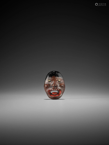 A LACQUERED WOOD MASK NETSUKE OF A MONST…