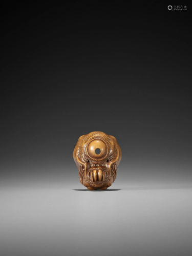 SANSHO (ATTR.): A RARE WOOD MASK NETSUKE…