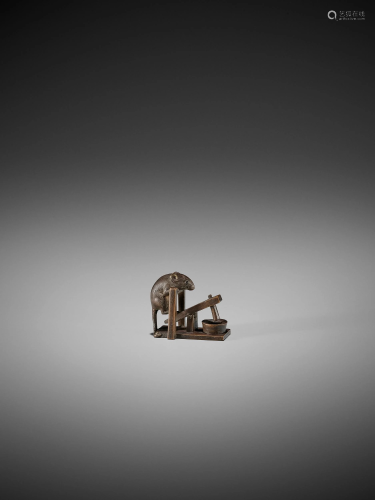 A FINE NETSUKE OF A RAT ON A MORTAR