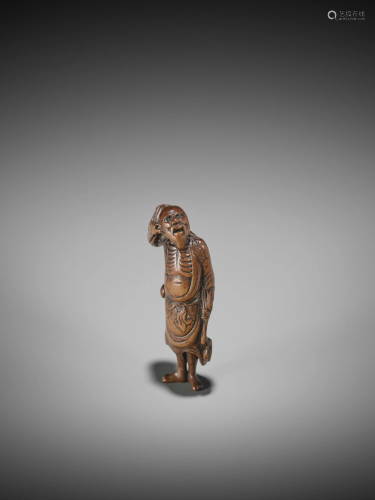 A WOOD NETSUKE OF TEKKAI SENNIN