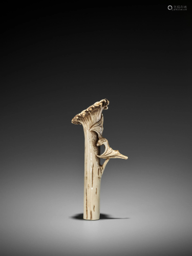 A STAG ANTLER SASHI NETSUKE OF A BAT ON REISH…