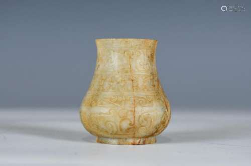 A SMALL ARCHAISTIC JADE VASE QING