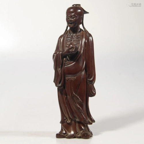 A CARVED BOXWOOD FIGURE