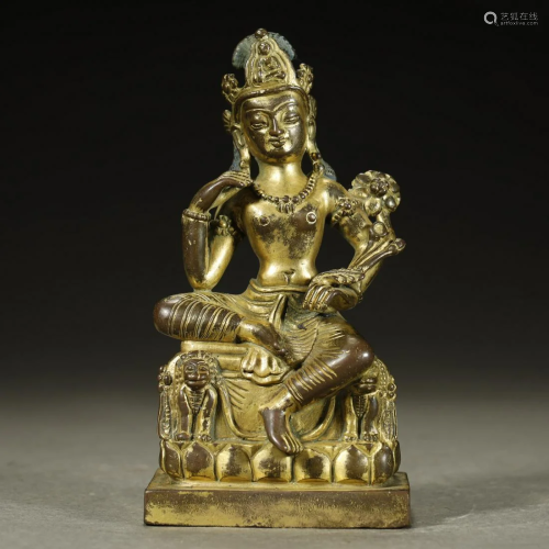 AN ARCHAIC GILT-BRONZE BUDDHA FIGURE,GU…